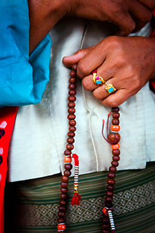 Tibetan woman with Buddhist prayer beads Tibetan woman with Buddhist prayer beads